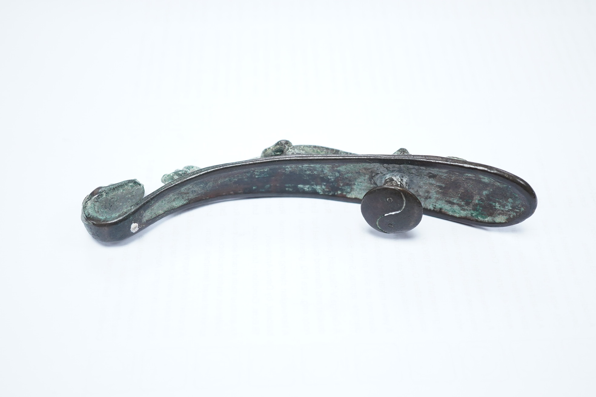 A Chinese bronze belt hook, Song Dynasty or later, 13.5cm wide. Condition - good condition for age